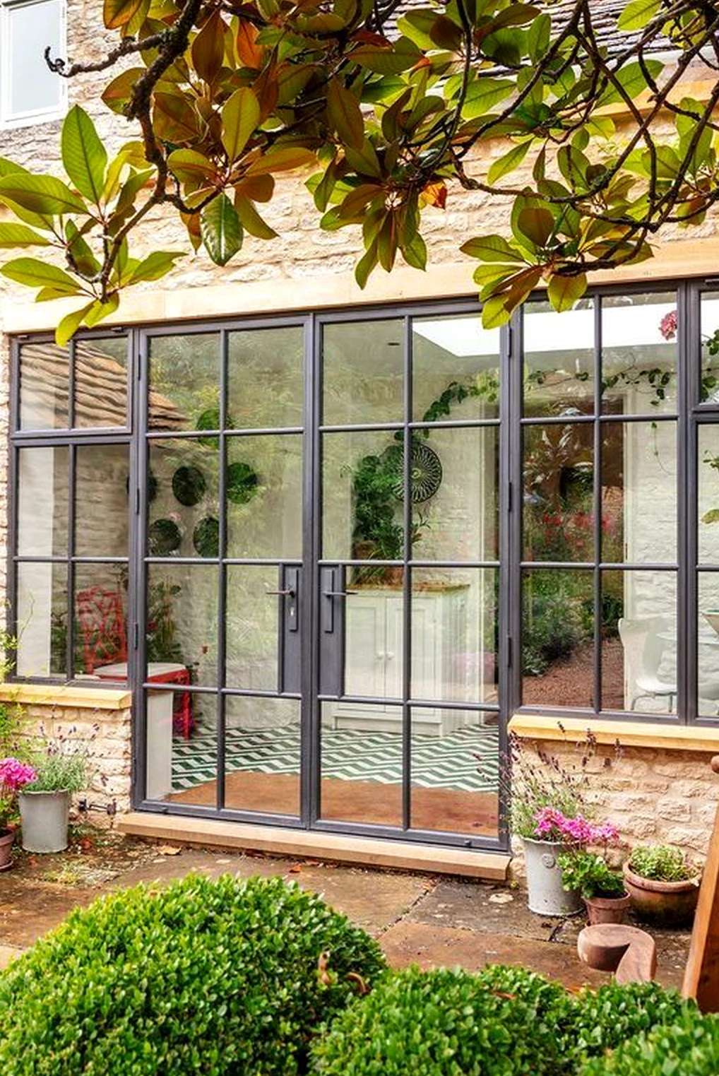 Warm stair landing anchors the outdoor space with detail, giving the view a mood that feels visually grounded.