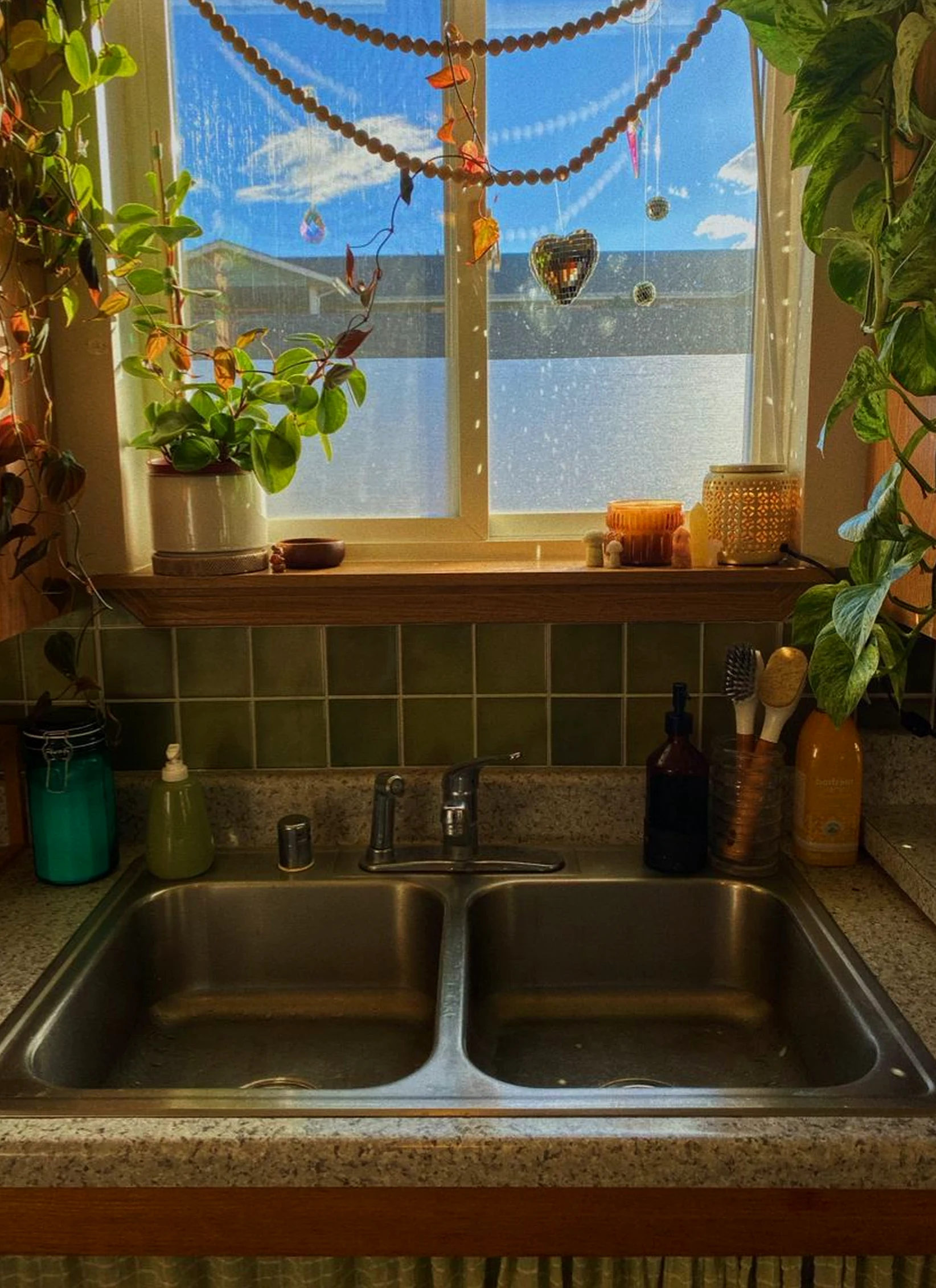 Bright kitchen nook adds a clear layer of light, helping the wall feel settled and welcoming.