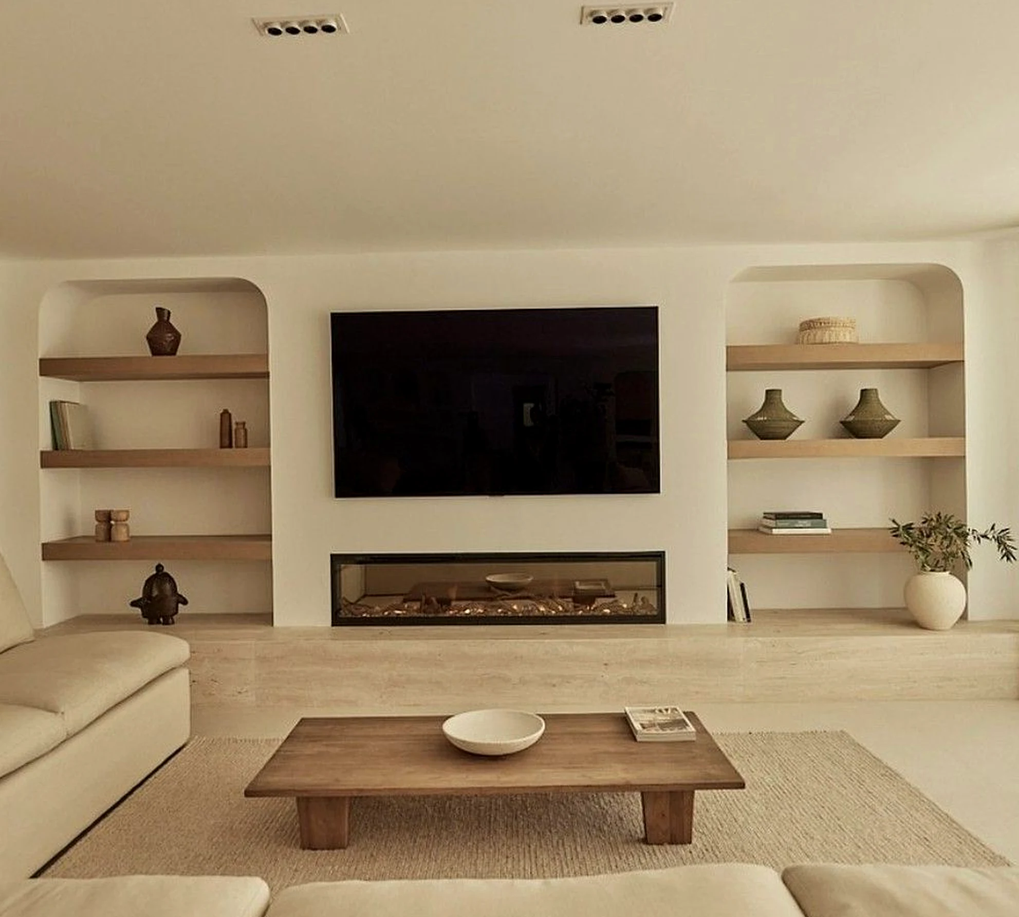Layered tile detail introduces softness into the sitting area, keeping the atmosphere visually grounded.