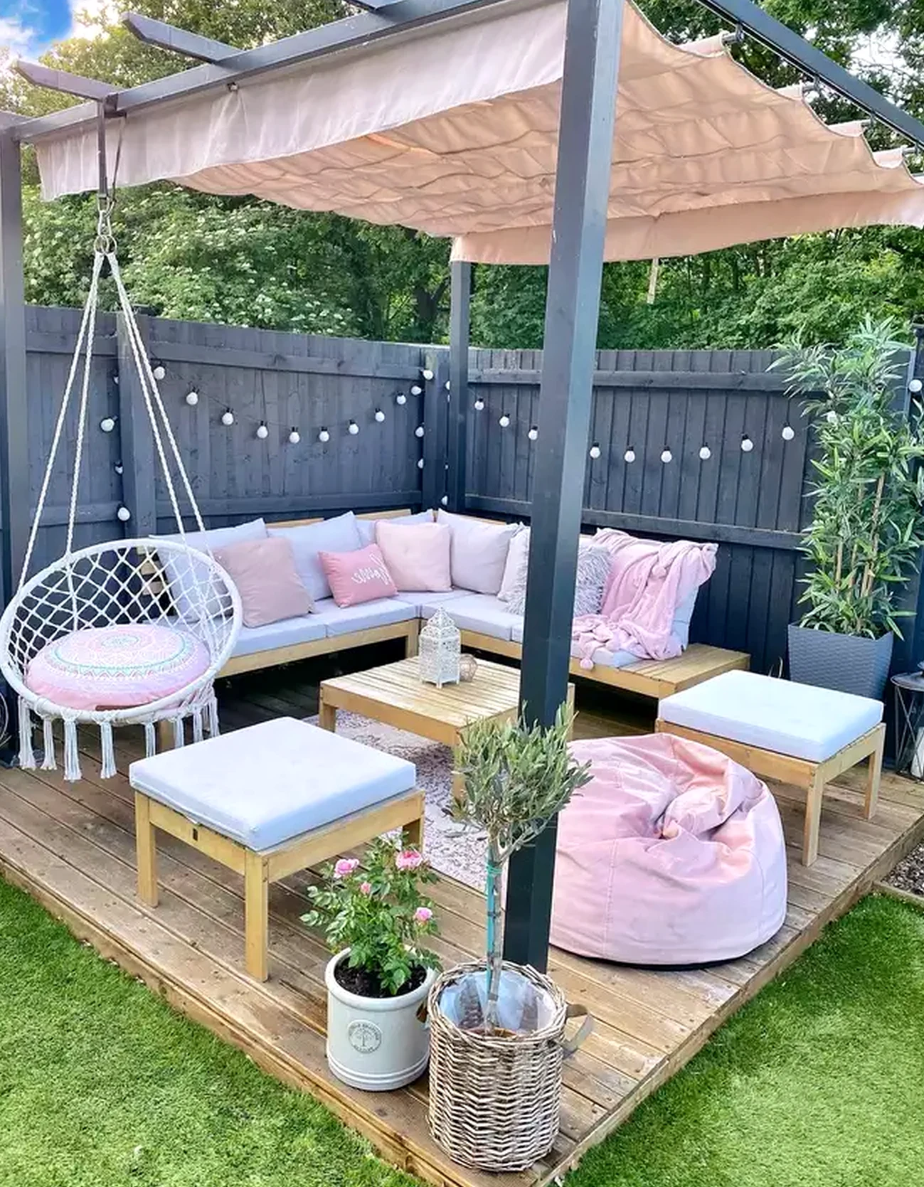Simple dining setup anchors the garden edge with focus, giving the view a mood that feels personal and relaxed.