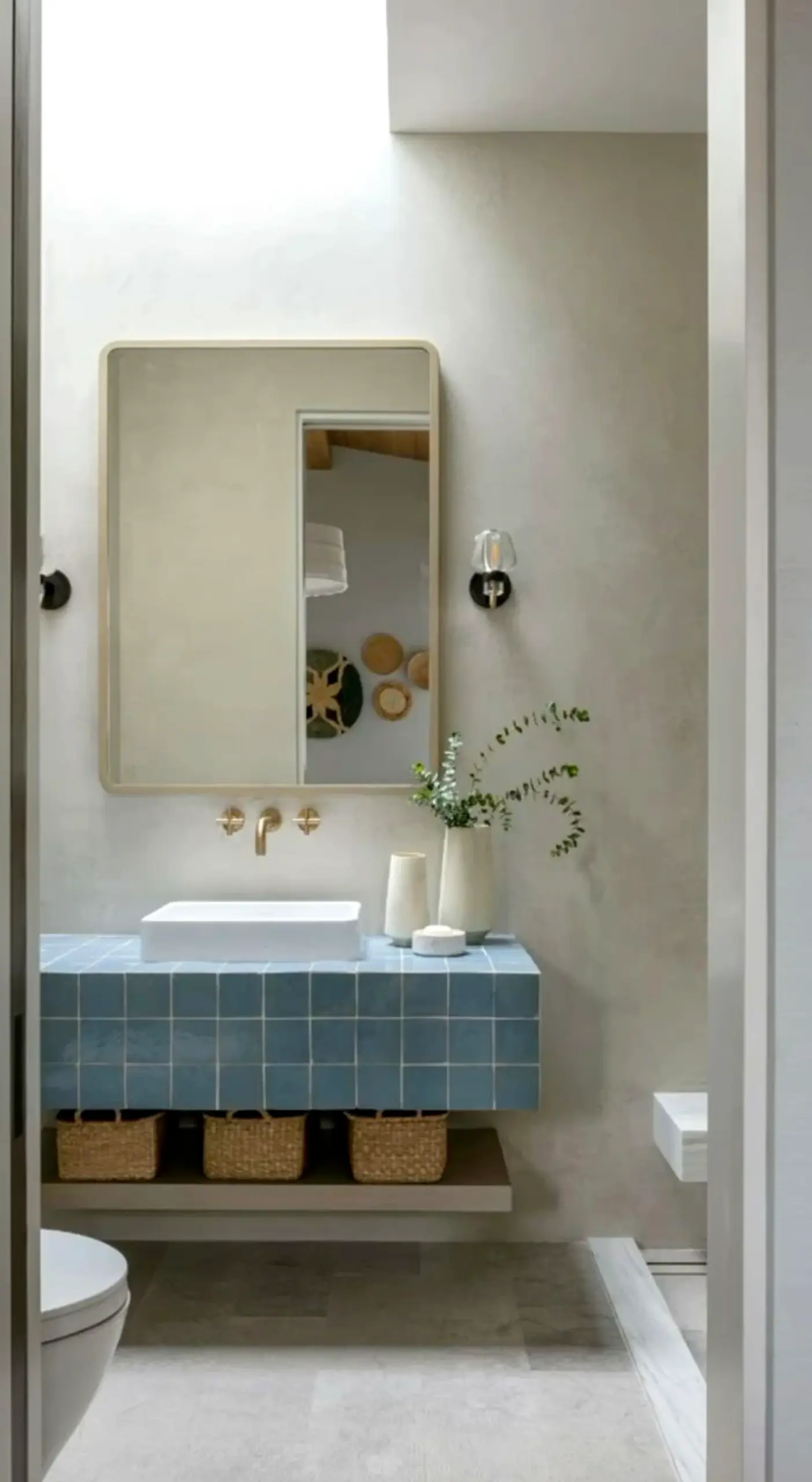 Graceful neutral bedroom frames the wall with light, making the scene feel settled and welcoming.