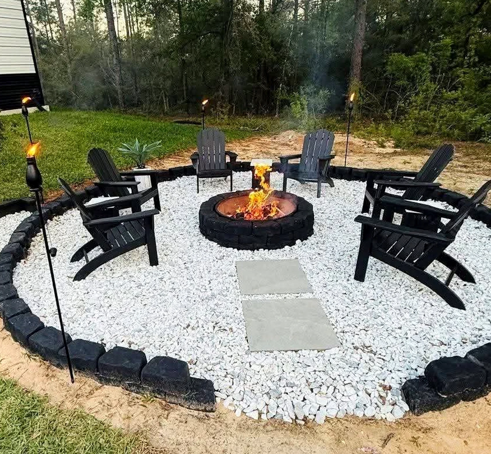 Graceful garden seating brings rhythm to the setting, creating a mood that feels settled and welcoming.