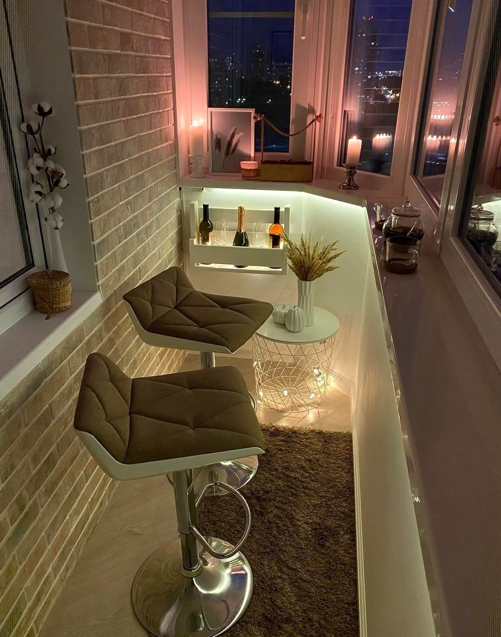 Warm balcony scene brings a useful note of depth, making the design feel quietly finished.