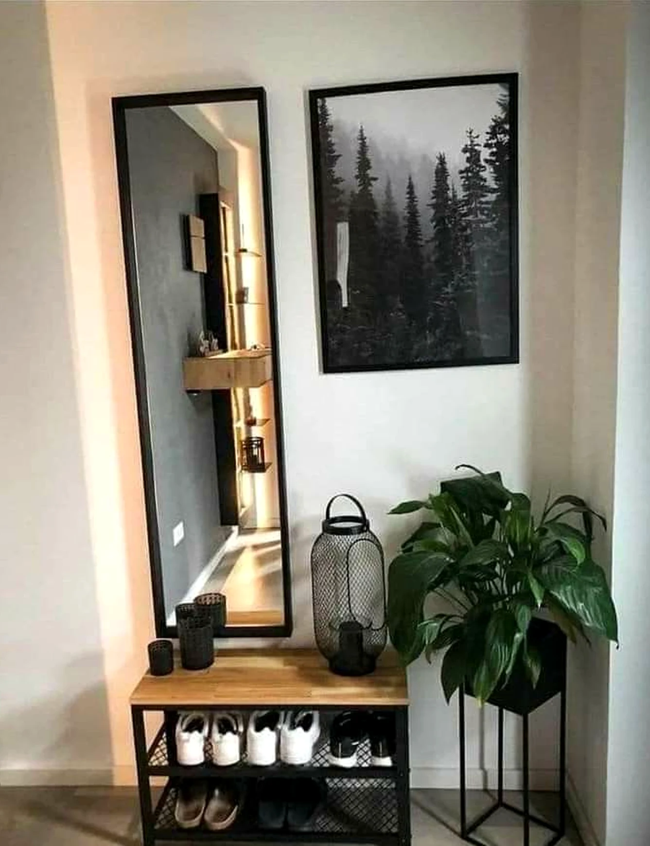 Sculptural decorative mirror brings contrast to the wall, creating a mood that feels fresh and intentional.
