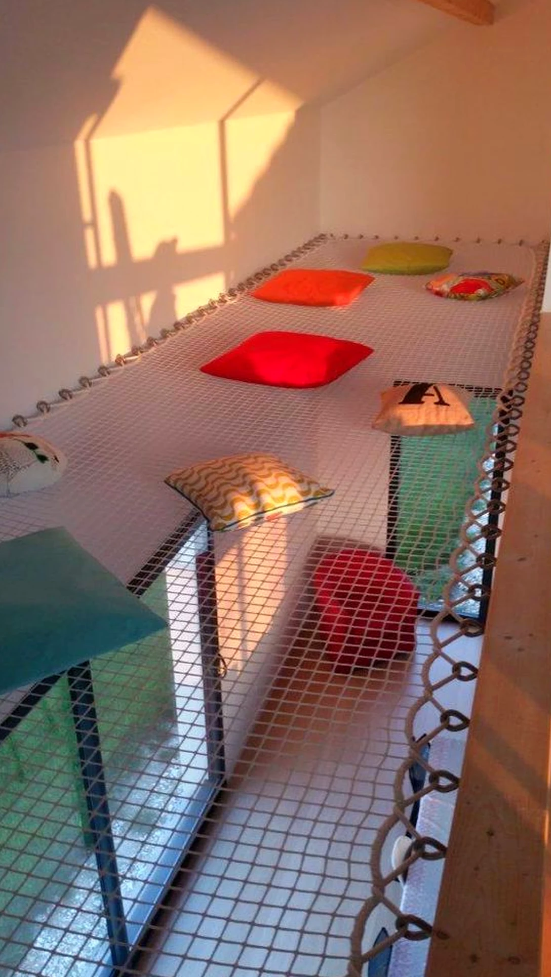 Warm balcony scene brings a useful note of softness, making the arrangement feel clear and inviting.