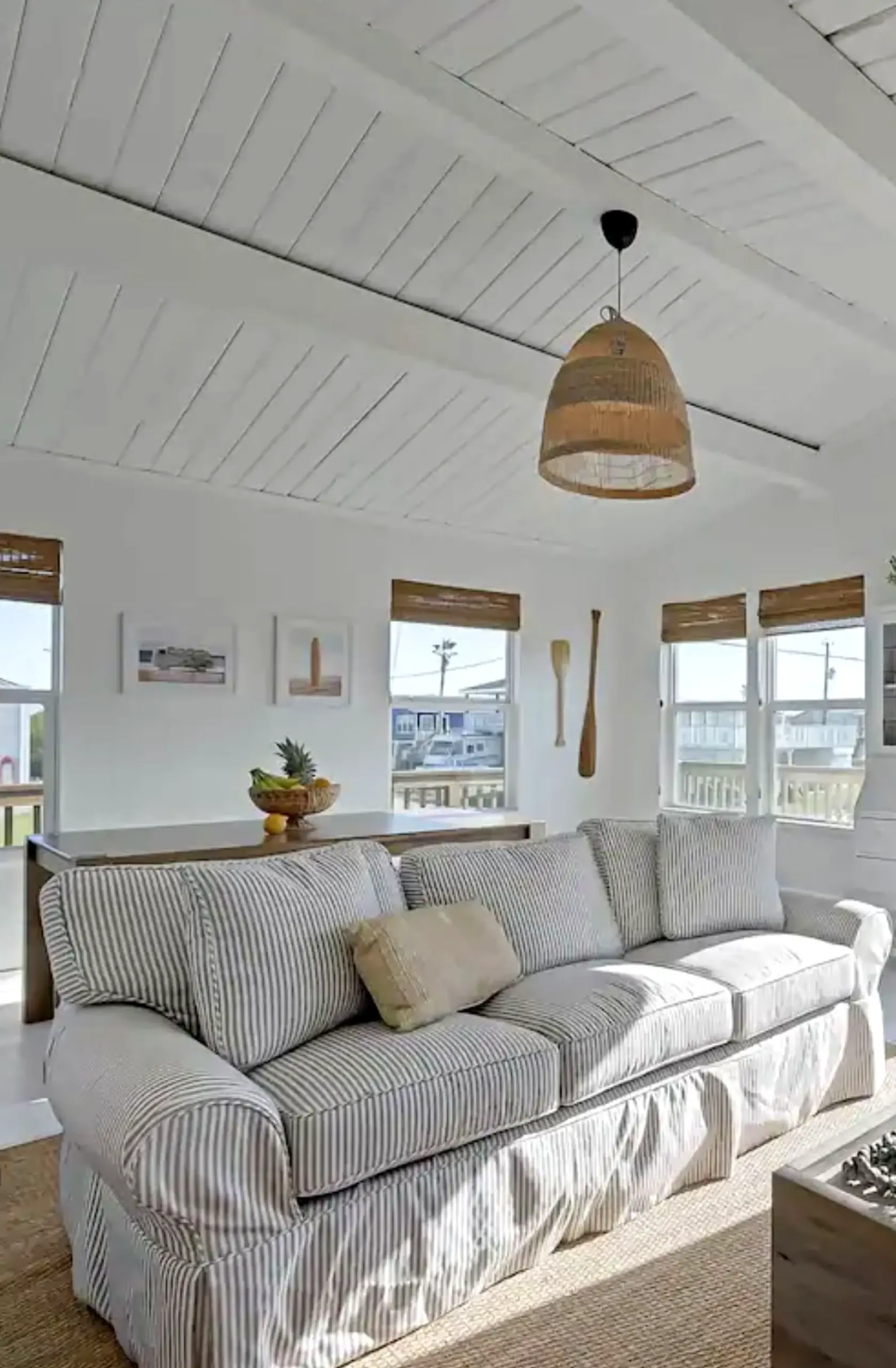Luminous ceiling detail draws attention to rhythm while the corner stays comfortable in daily use.